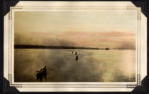 Canoes on the Bay of Quinte at dawn.