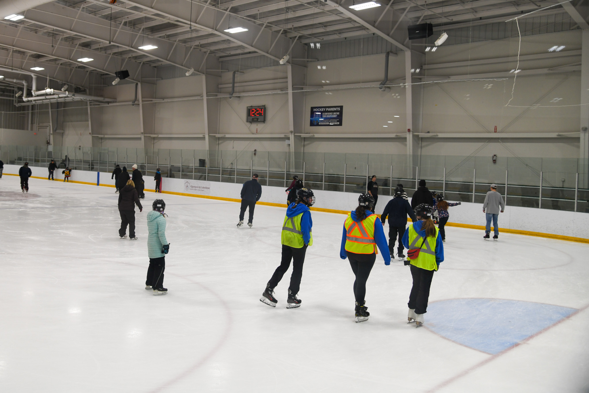 People skating on rink