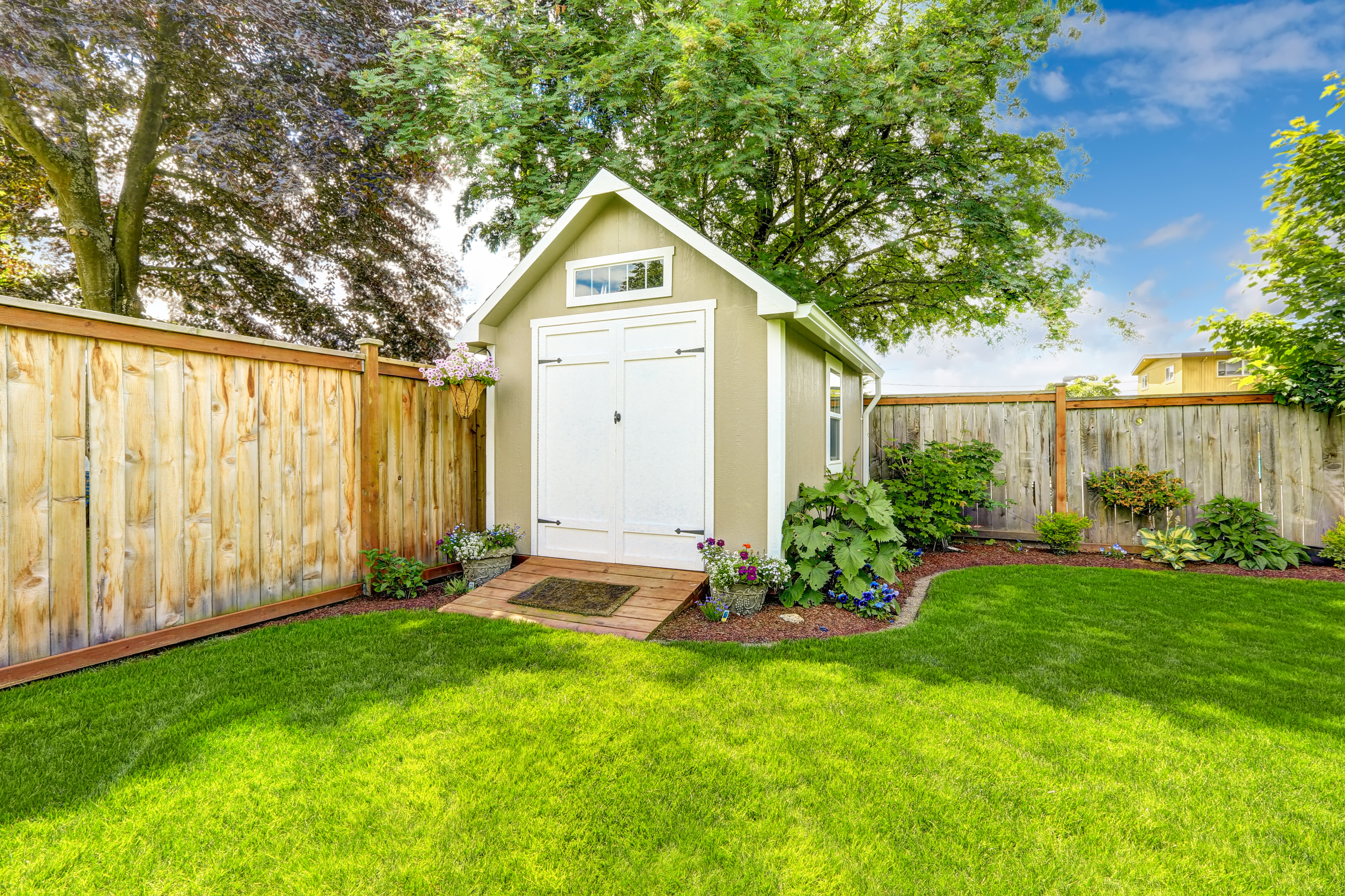 Backyard with shed along fenceline