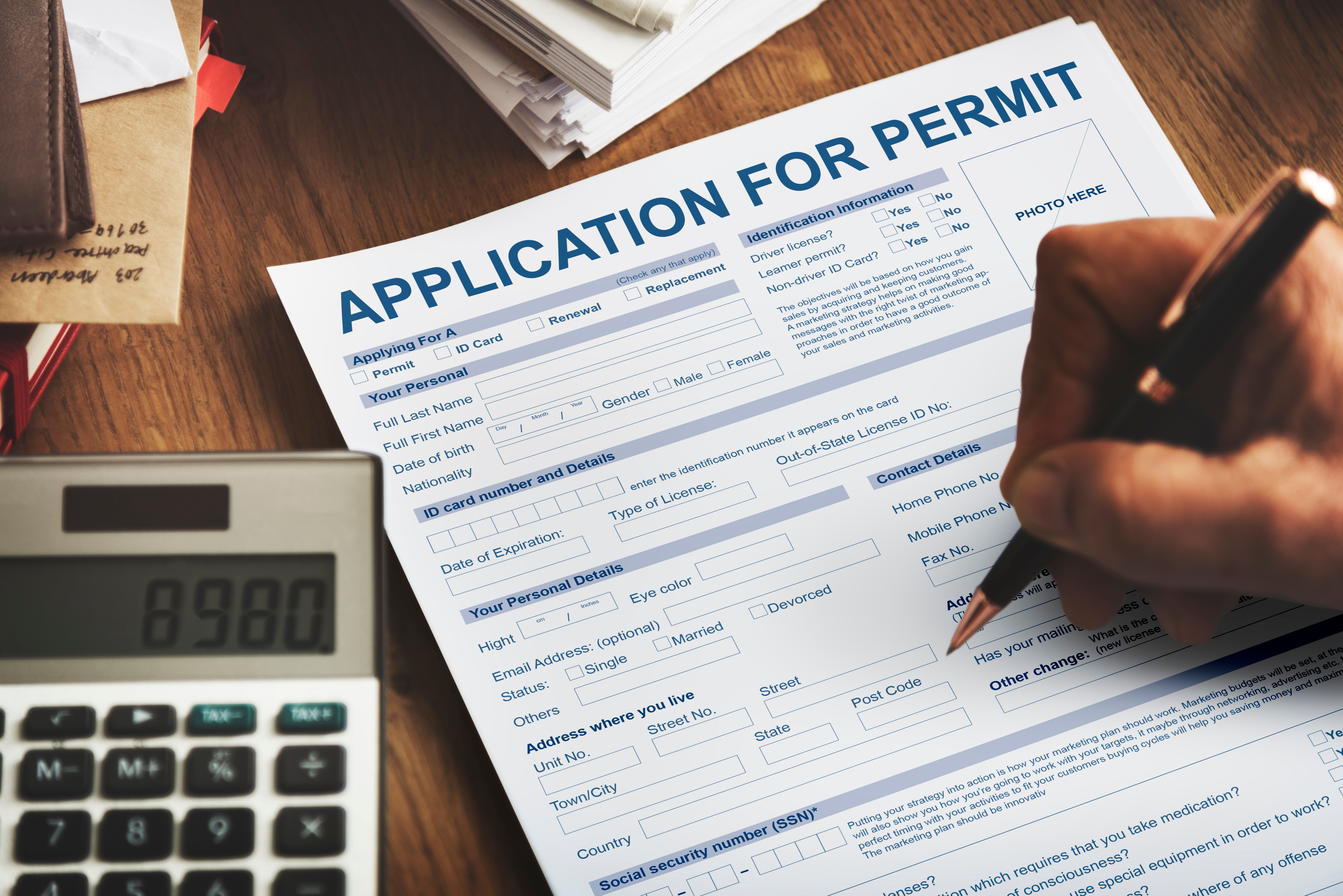 Person filling out building permit