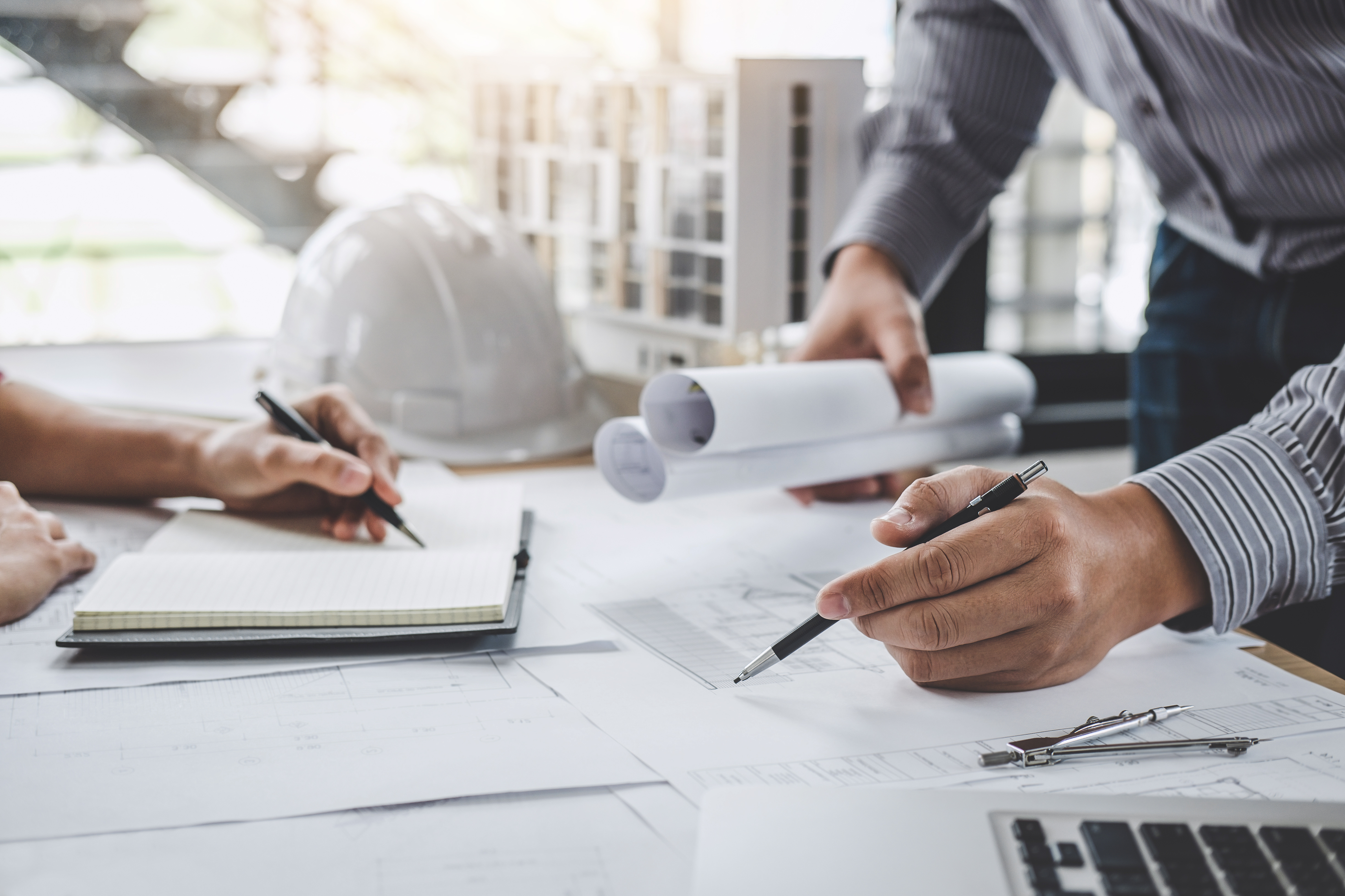 People working on construction designs