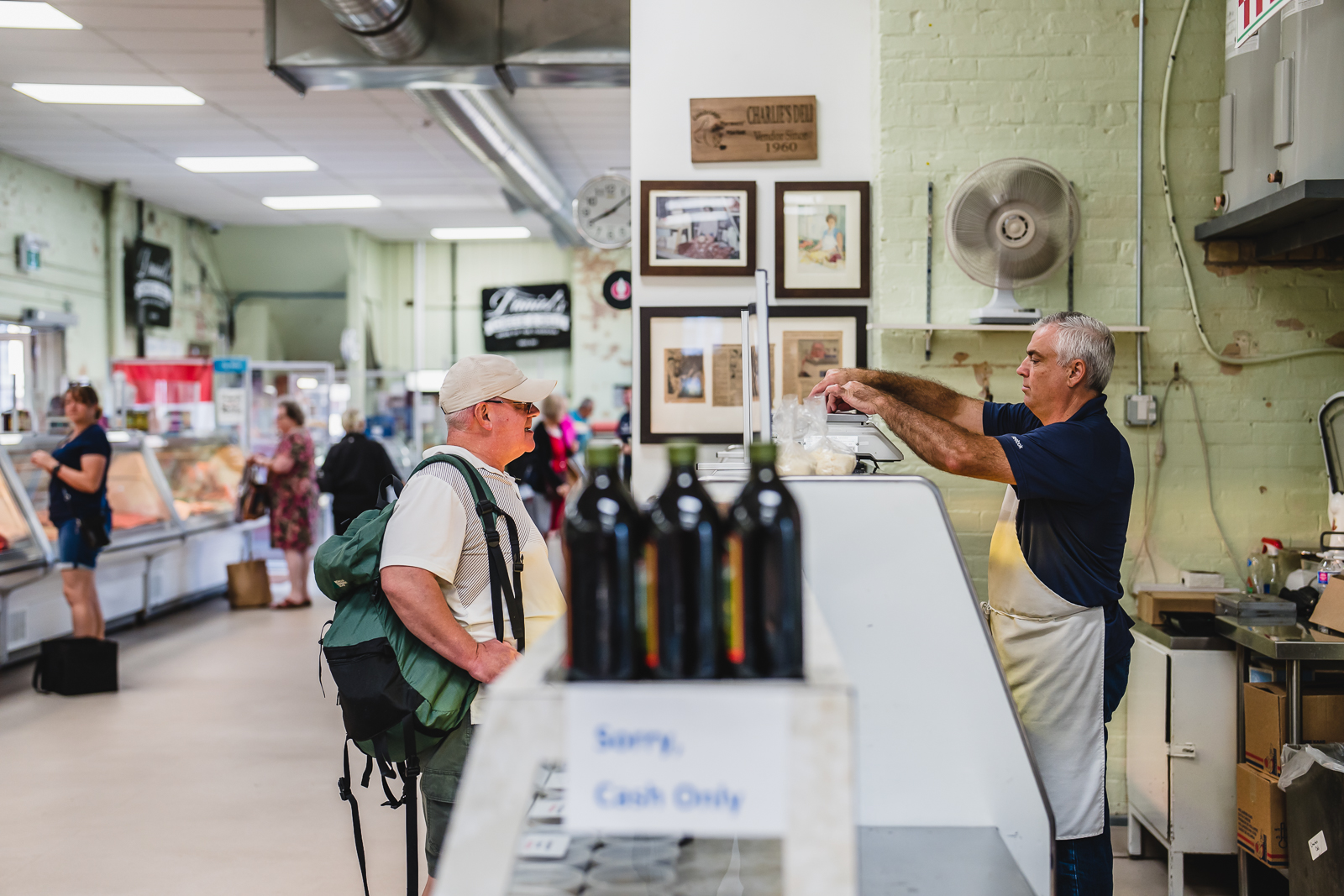 Indoor cheese vendor at the market.