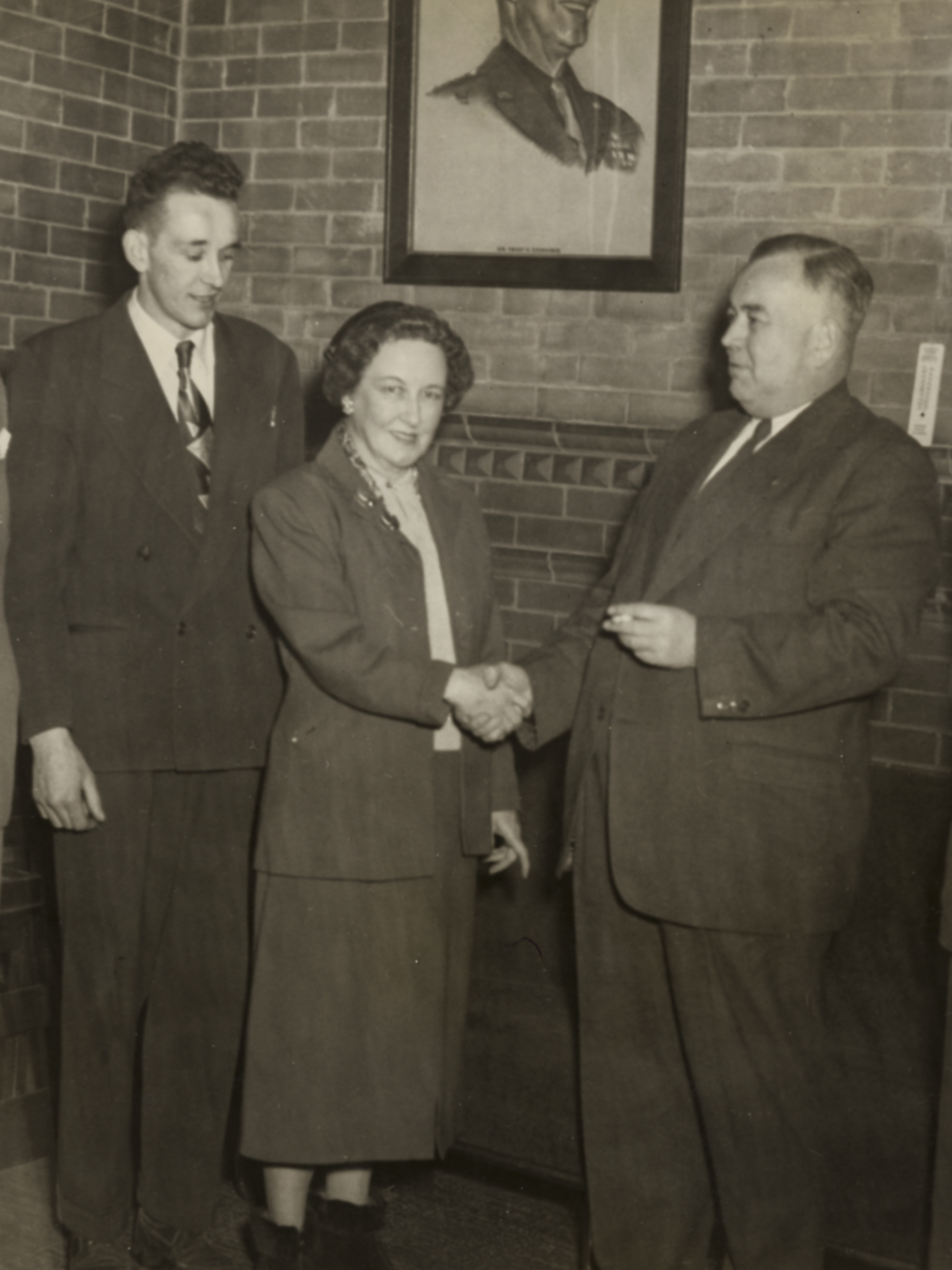 Two men with Woodstock mayor Bernadette Smith