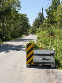 Apple bin on West Beach Road with an historic image of an old sail boat in the lake.