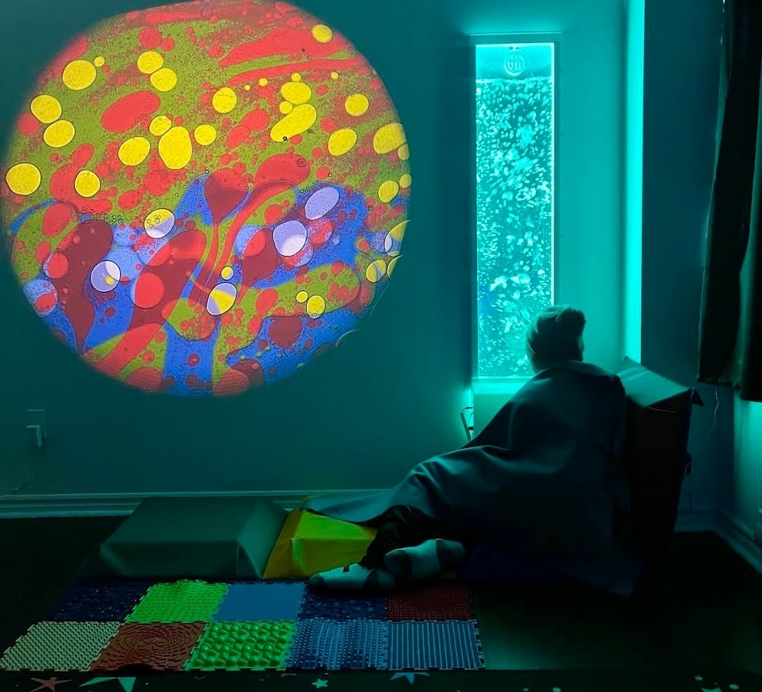 Snooze Room interior space with coloured low lighting.