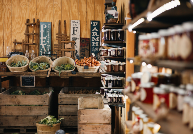 indoor display of jams and vegetables at farm market