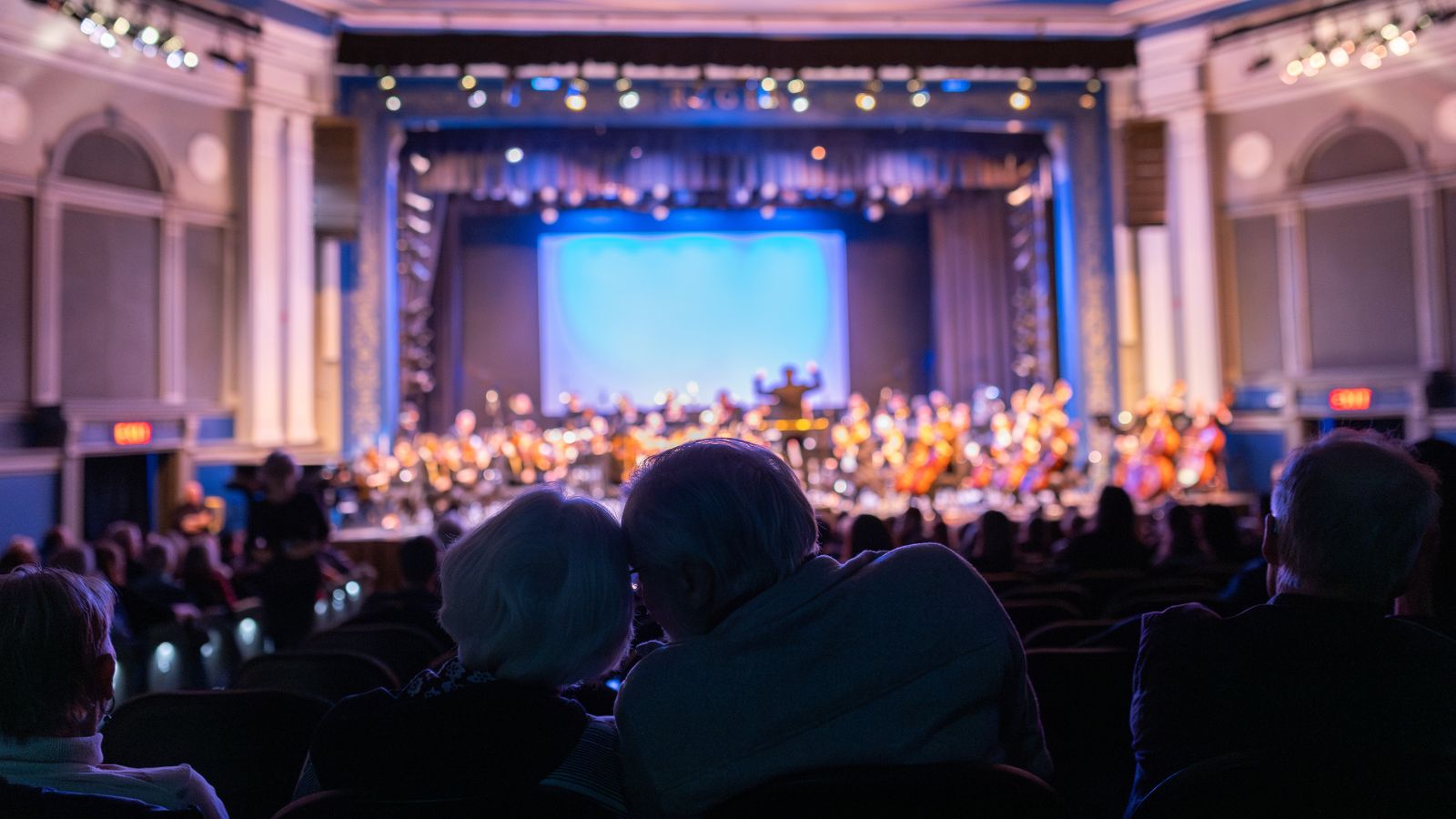 Couple watching a performance at Regent Theatre in Oshawa, Ontario