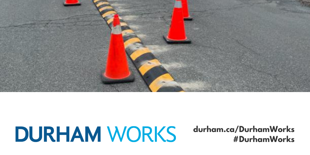 A photo of a hardened centre line with pylons surrounding it, the Durham Works logo and text reading durham.ca/DurhamWorks #DurhamWorks