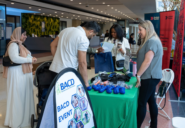 People visiting vendors at the event.