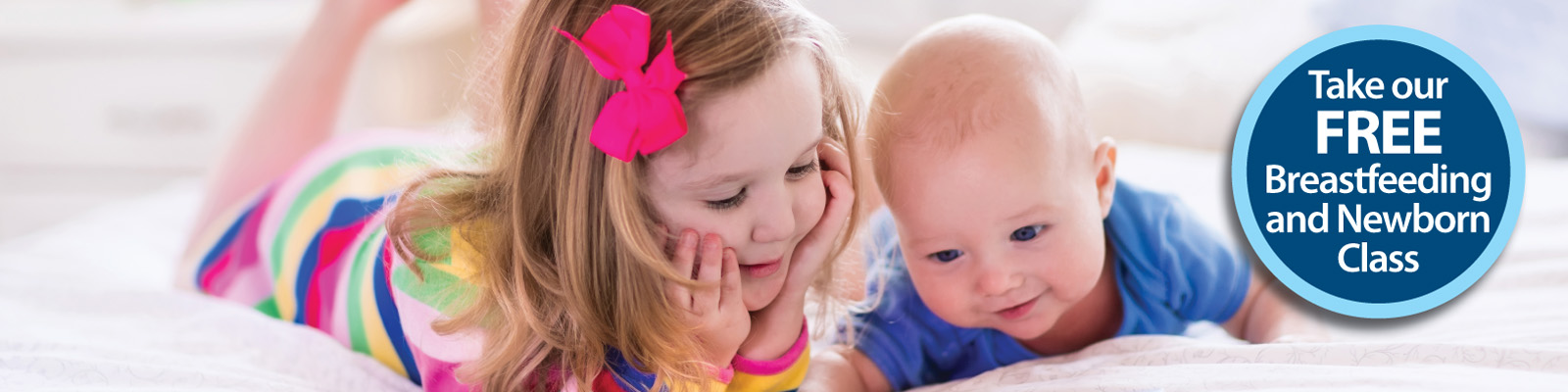 Baby and toddler interacting