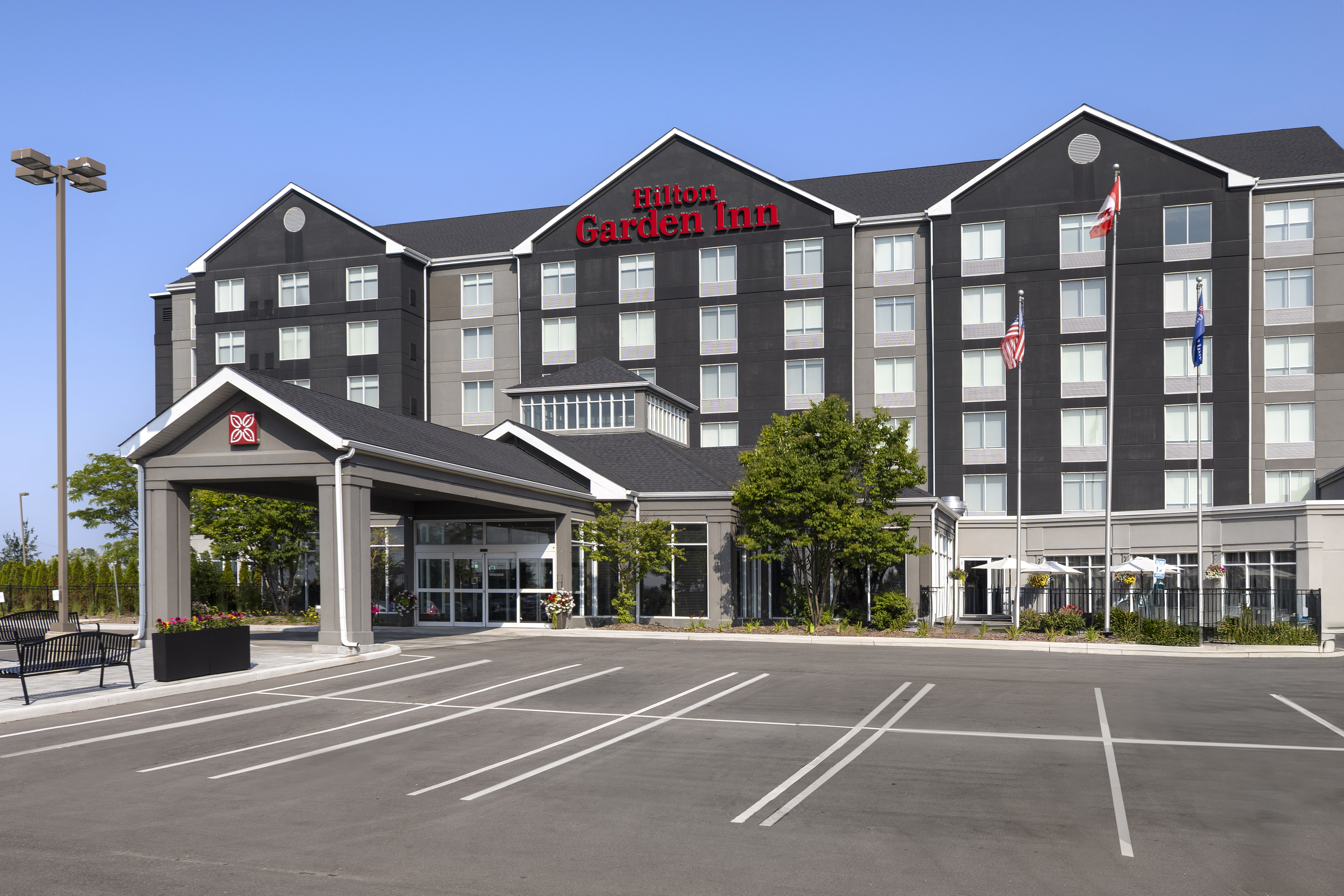 Exterior of Hilton Garden Inn hotel entrance and parking lot