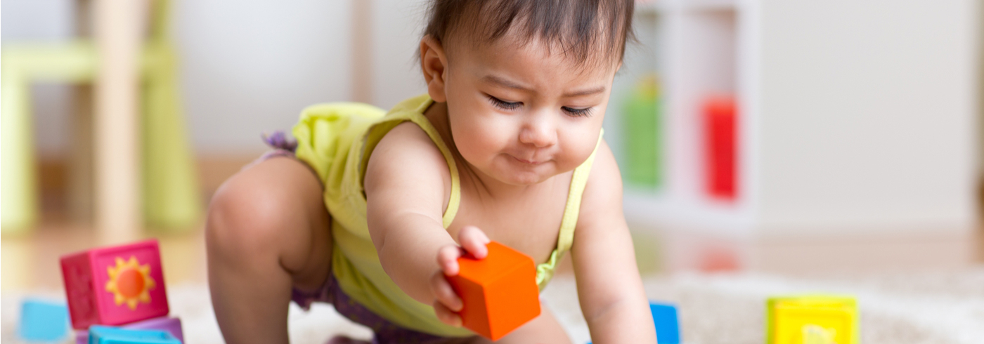 Baby playing with blocks