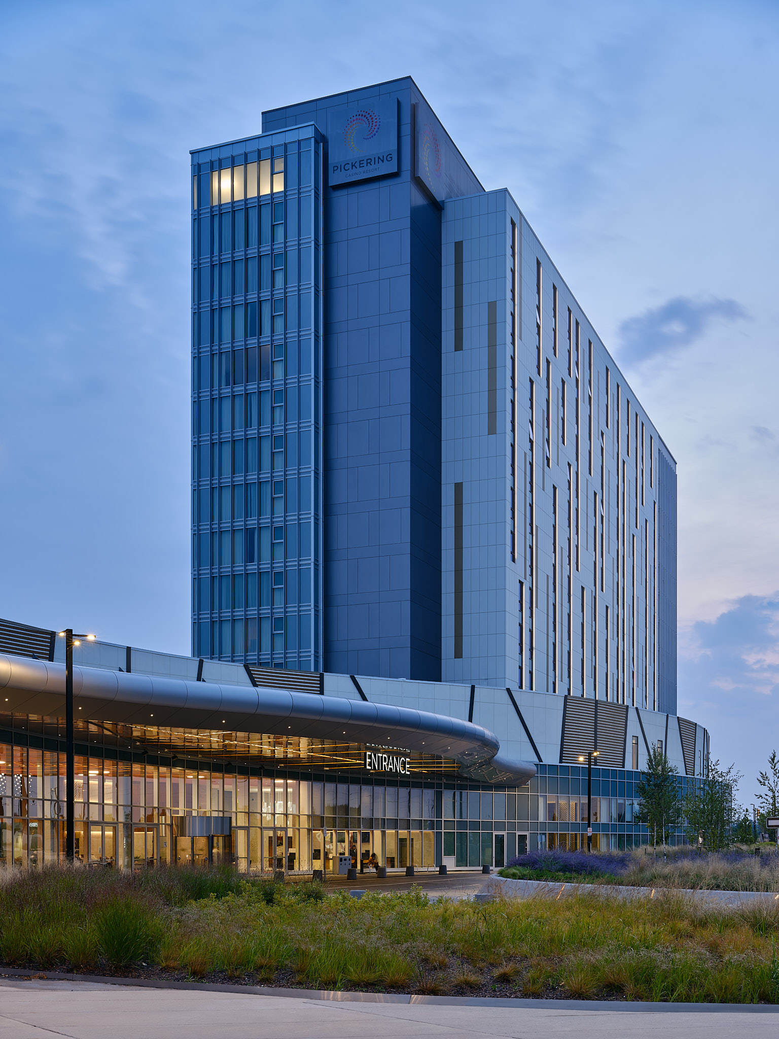 Exterior image of hotel under a bright blue sky