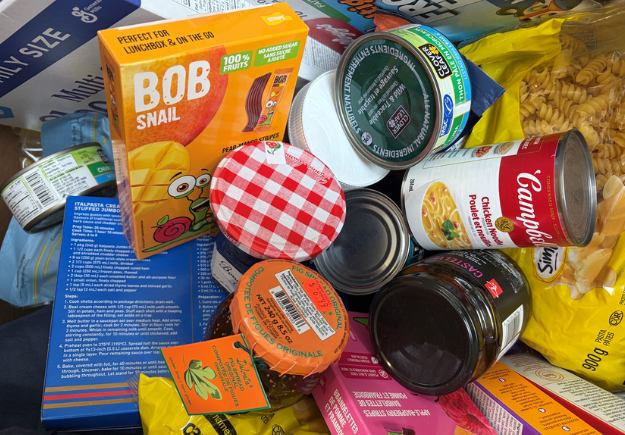 A stack of non-perishable food items.