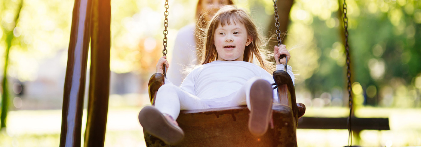 Girl on a playground swing