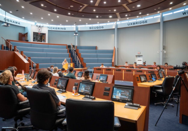 students seated in Regional council chambers