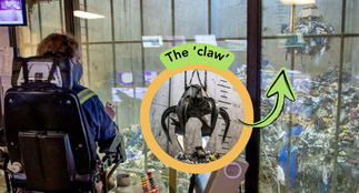 An operator in the control room operating the crane in the waste pit with an inlaid circular bubble showing a close up version of the ‘claw.’