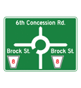 A road sign indicating which way is which in a roundabout