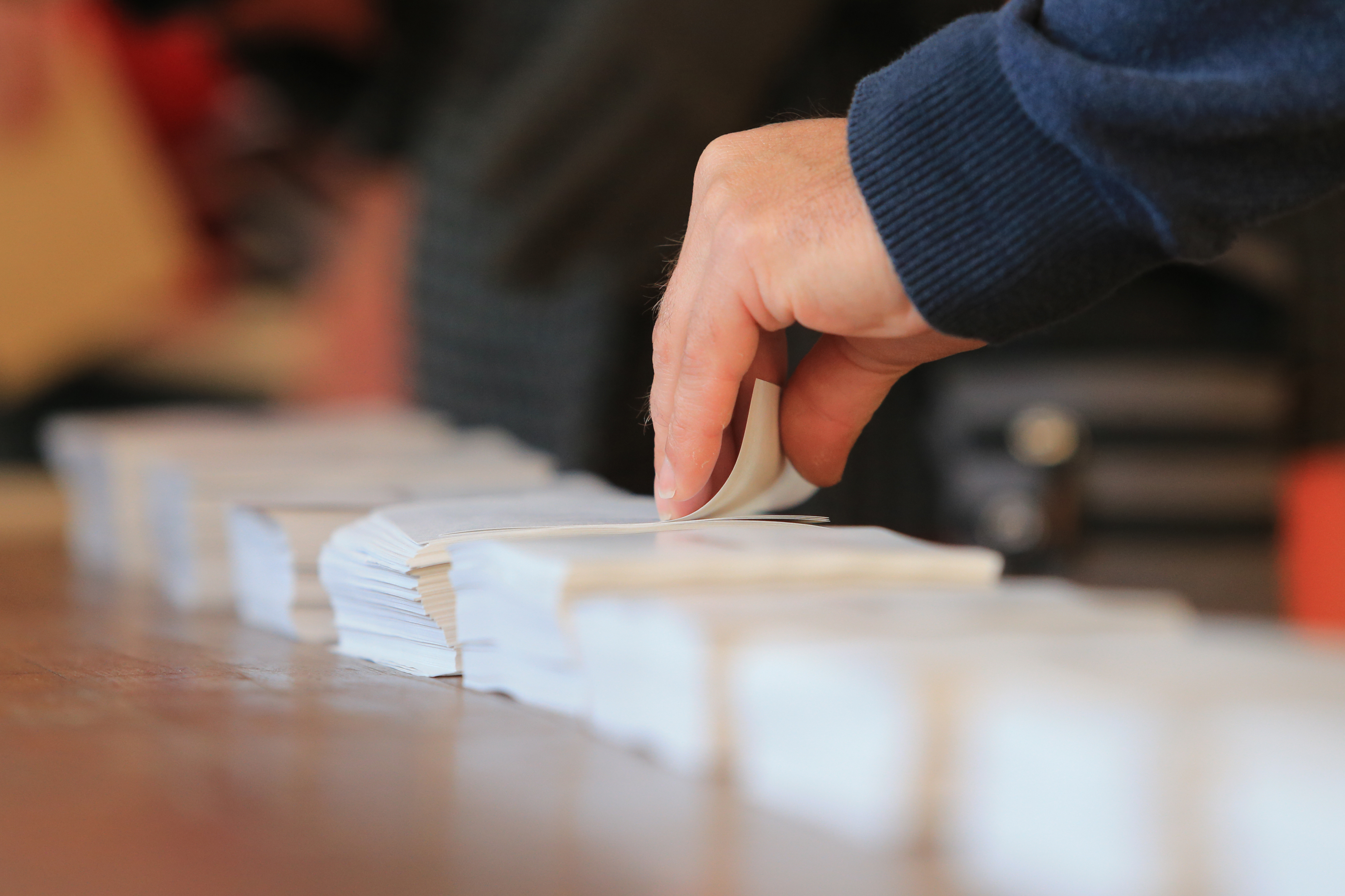 hand sorting papers.