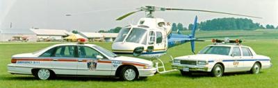 two police cruisers and helicopter from early 1990s