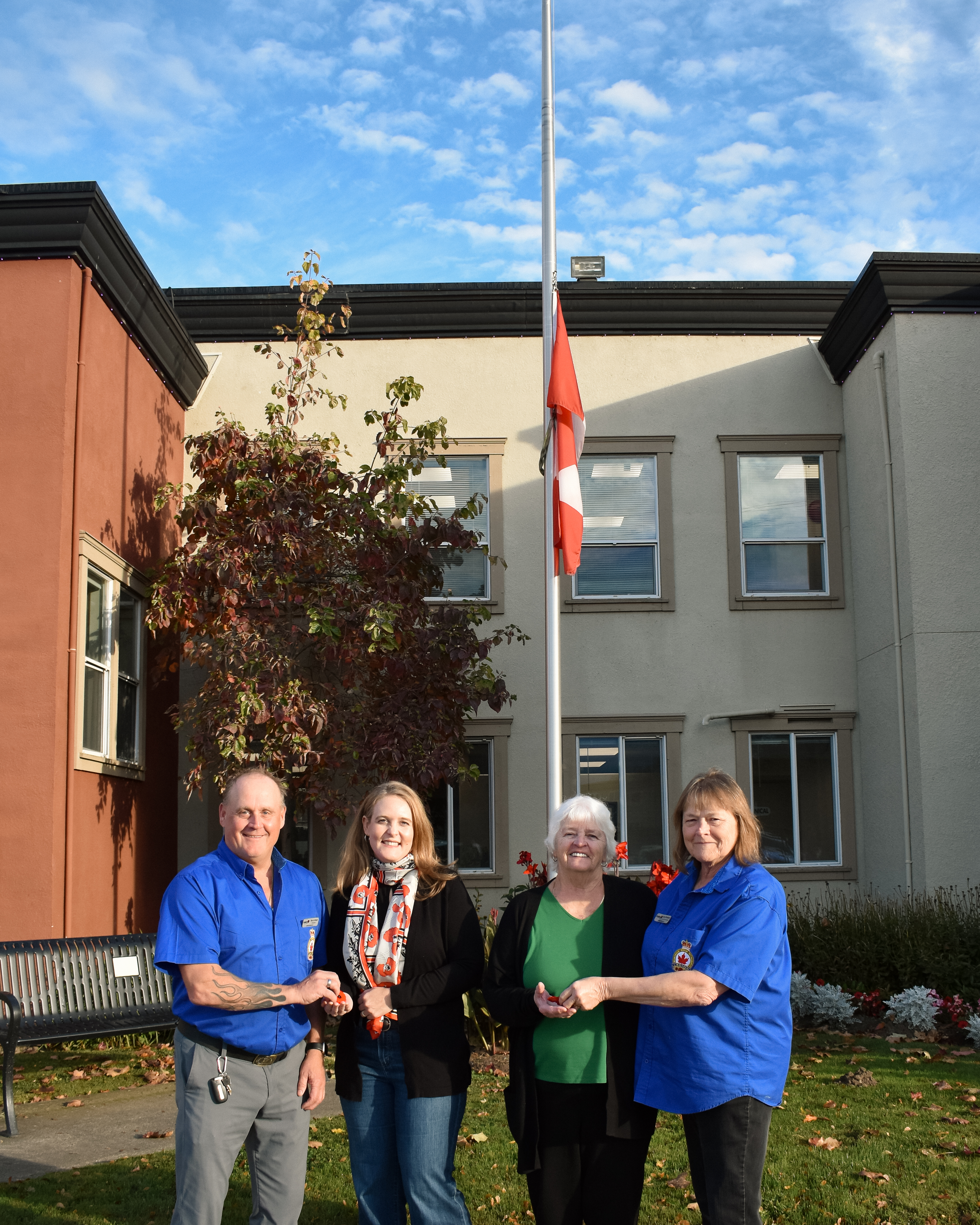 Mayor Pranger and Mayor-Elect Spaeti receiving a poppy each from an Agassiz Legion member