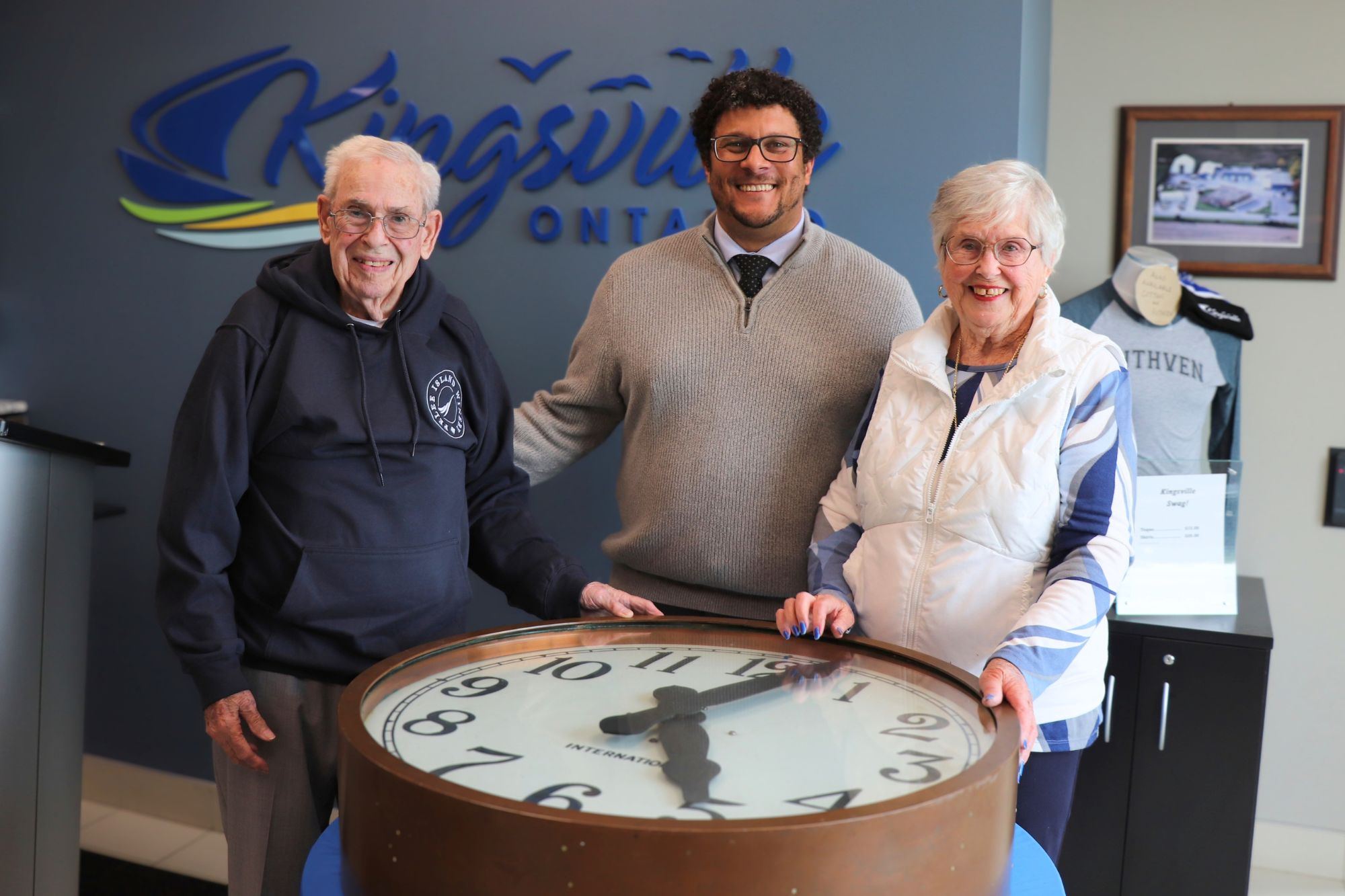 The Ellis family are pictured with Mayor Rogers at the Town's municipal office with the historic clock.