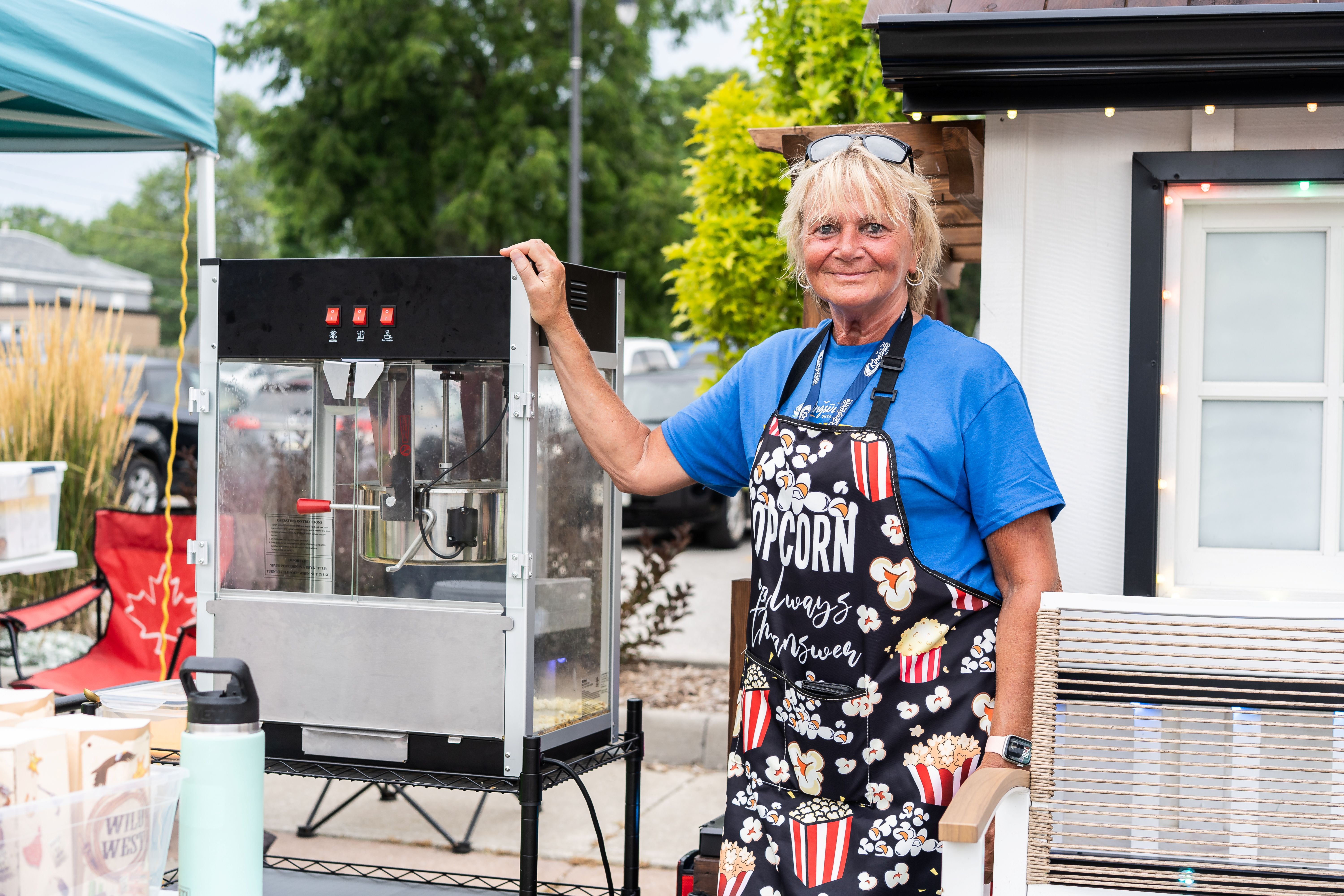 Volunteer makes popcorn at an event
