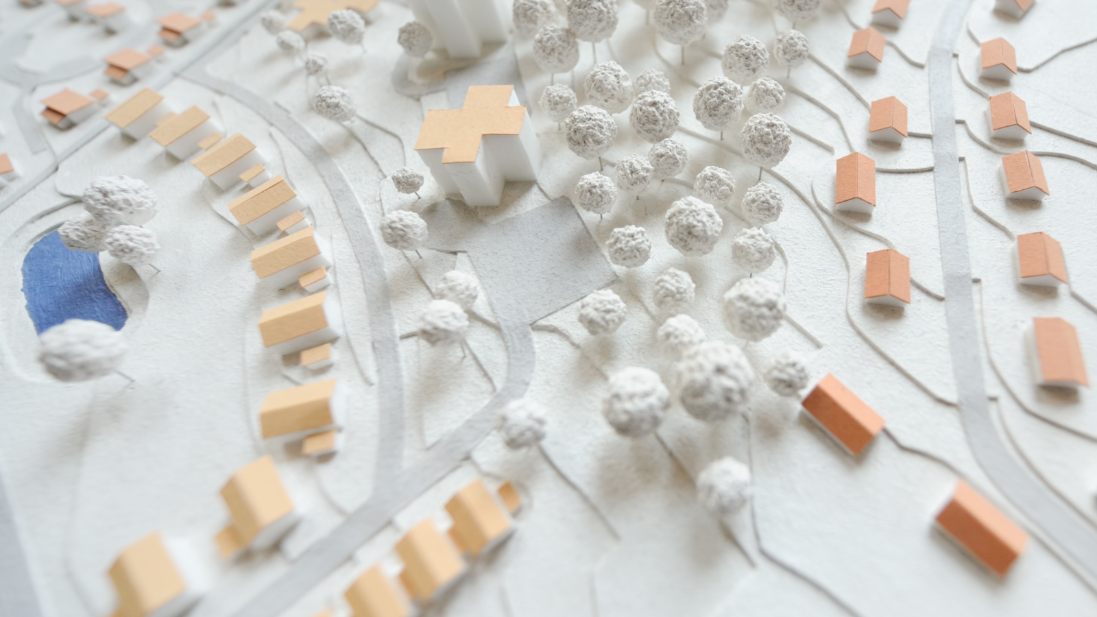Model of a city showing homes, trees and swimming pool