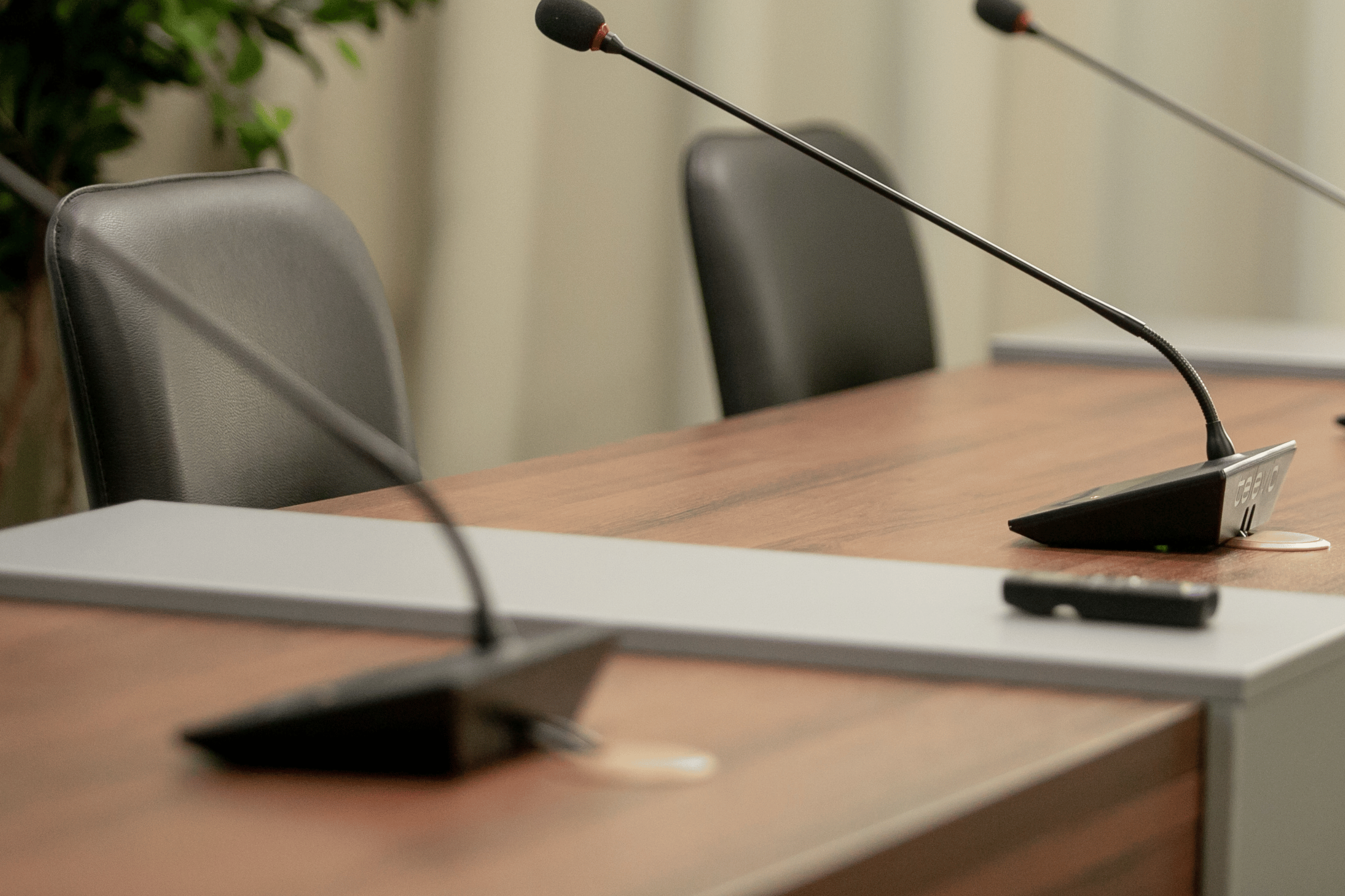 Meeting chairs and microphones at Council table