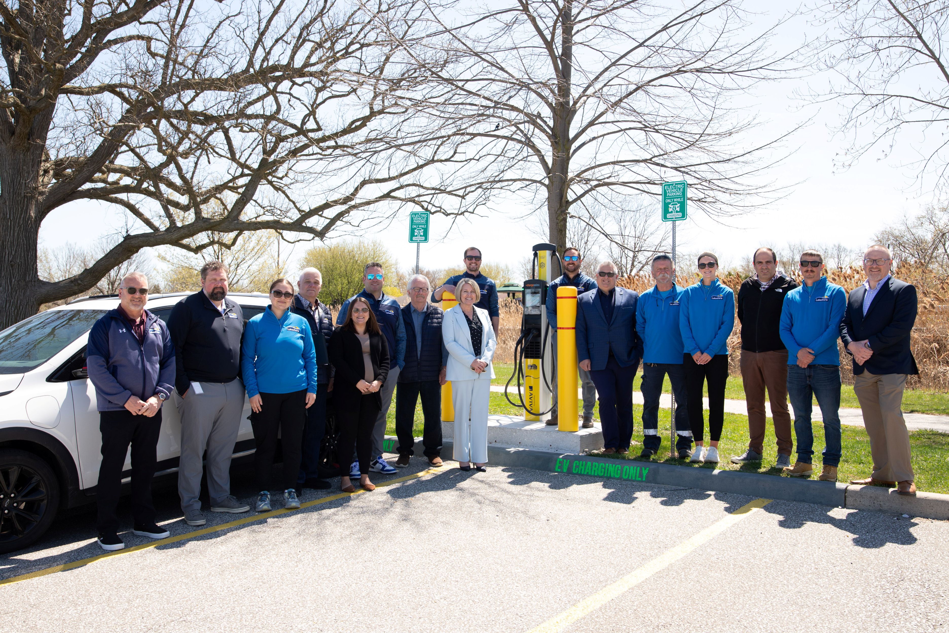 Group photo and Council and staff in front of new EV charging station at Lakeview Park