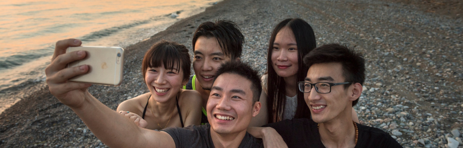 Teens on seacliff beach