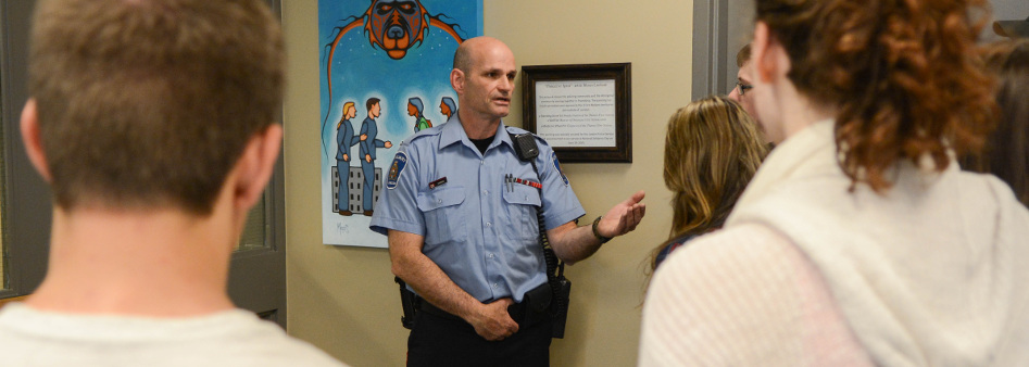 Auxiliary Officer conducting tour of LPS Headquarters