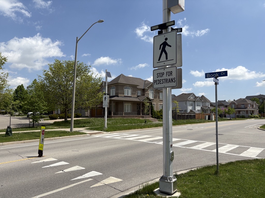 Painted pedestrian crossing without flashing beacons.