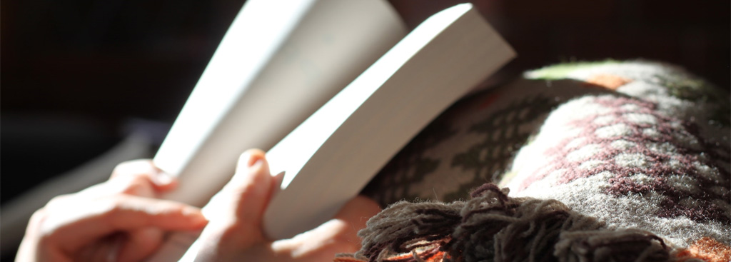 hands holding book