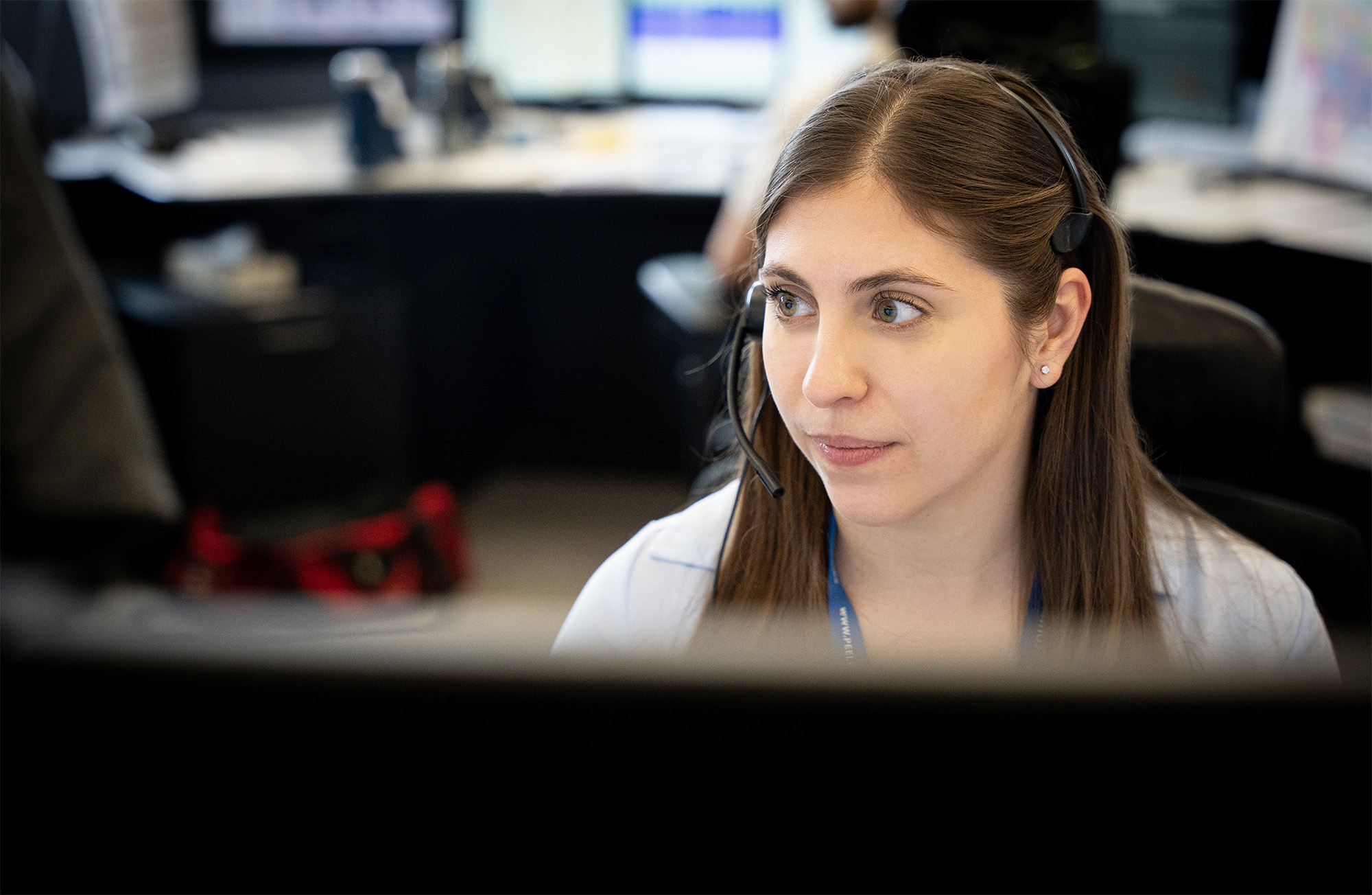 Police employee working at computer