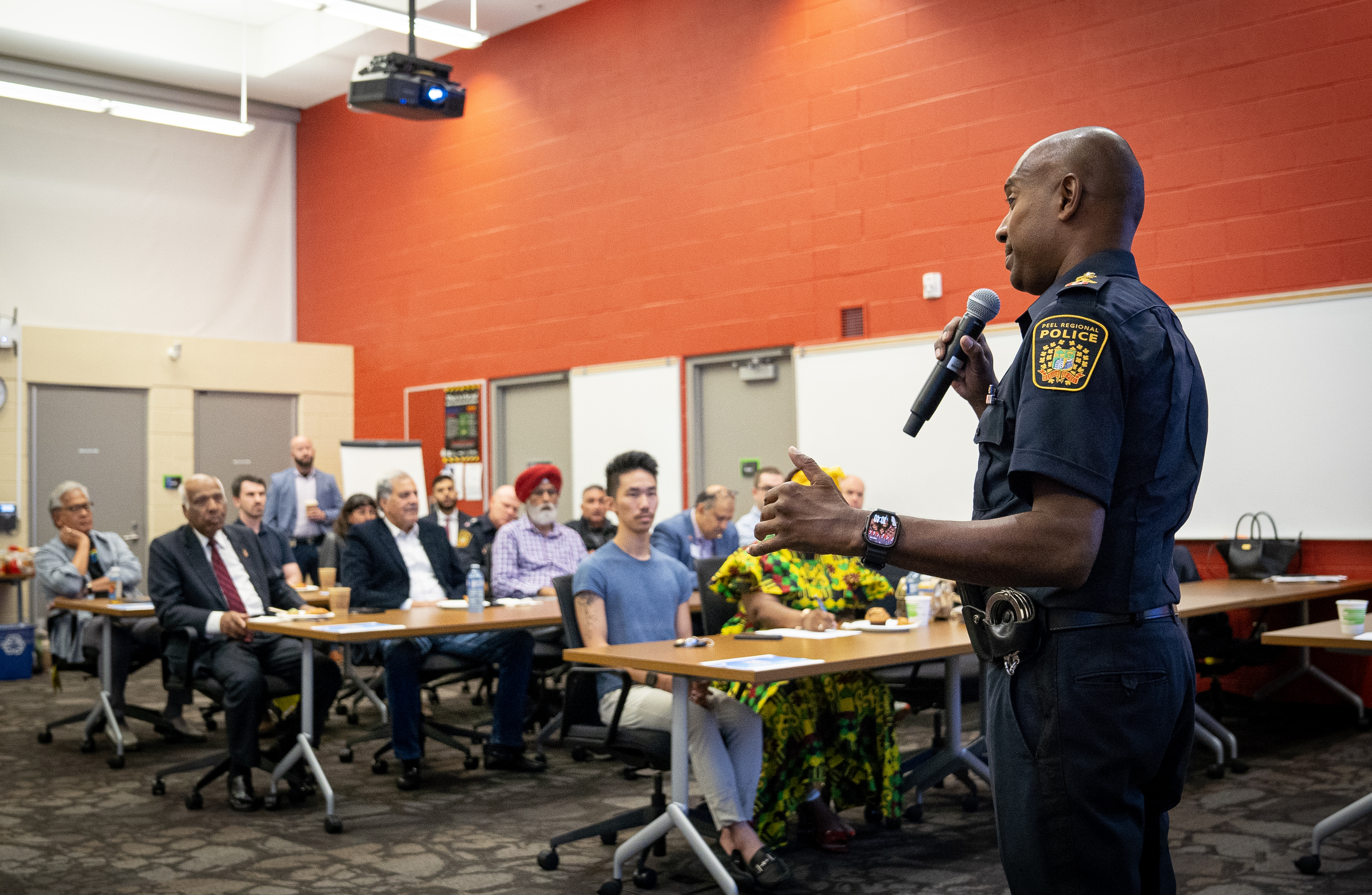 Police chief talking with multicultural group