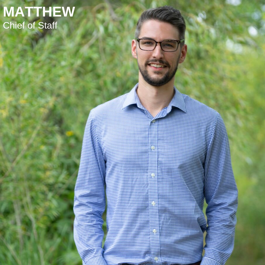 Man standing in the middle of a nature trail