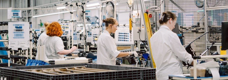 3 workers on assembly line at LTI