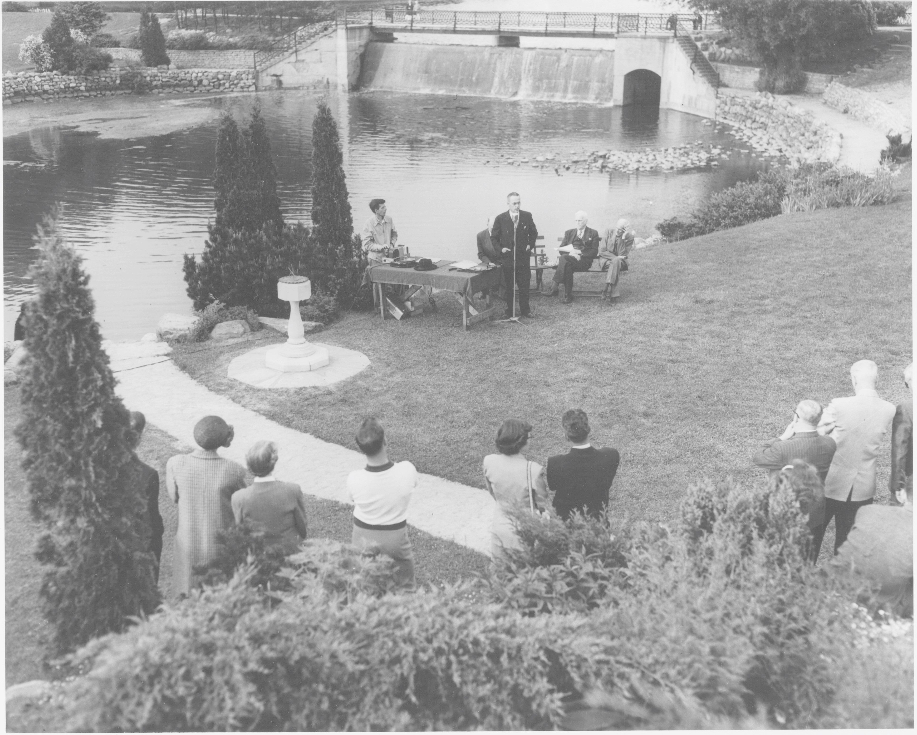 Crowd of people standing around a speaker unveiling the Rotary Sundial in Stratford.