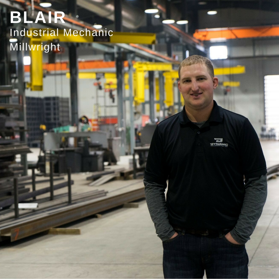 Young man standing in a manufacturing building