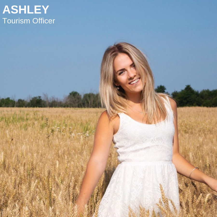 Blonde woman smiling in wheat field