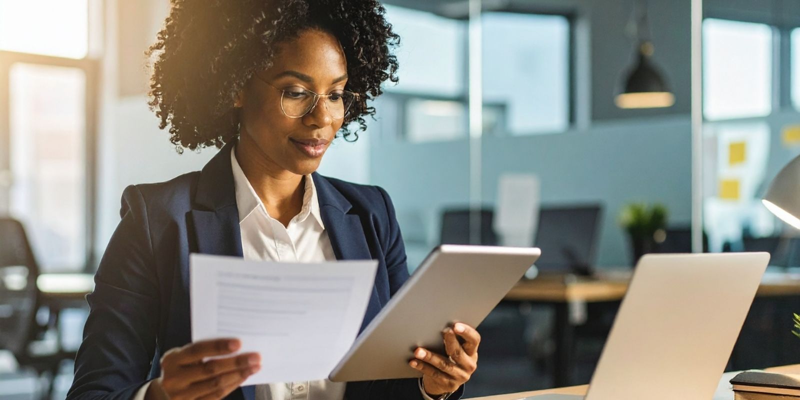 Professional woman examining papers, illustrating workplace and hiring process.