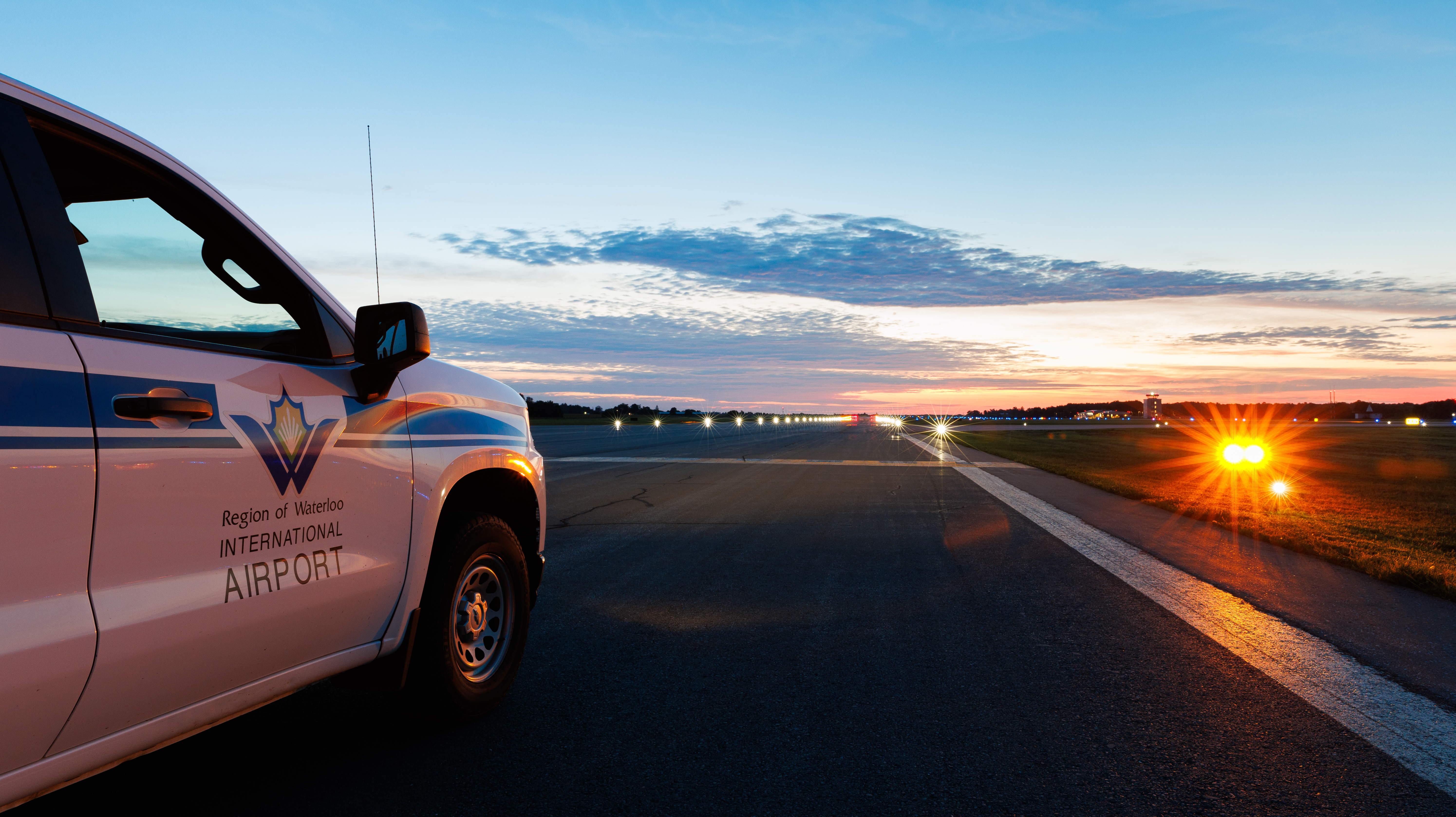 YKF vehicle parked on the runway at sunset