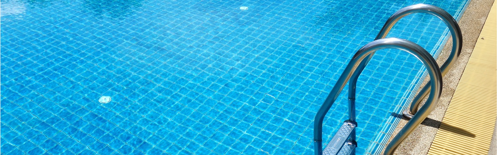 pool with a ladder into the water