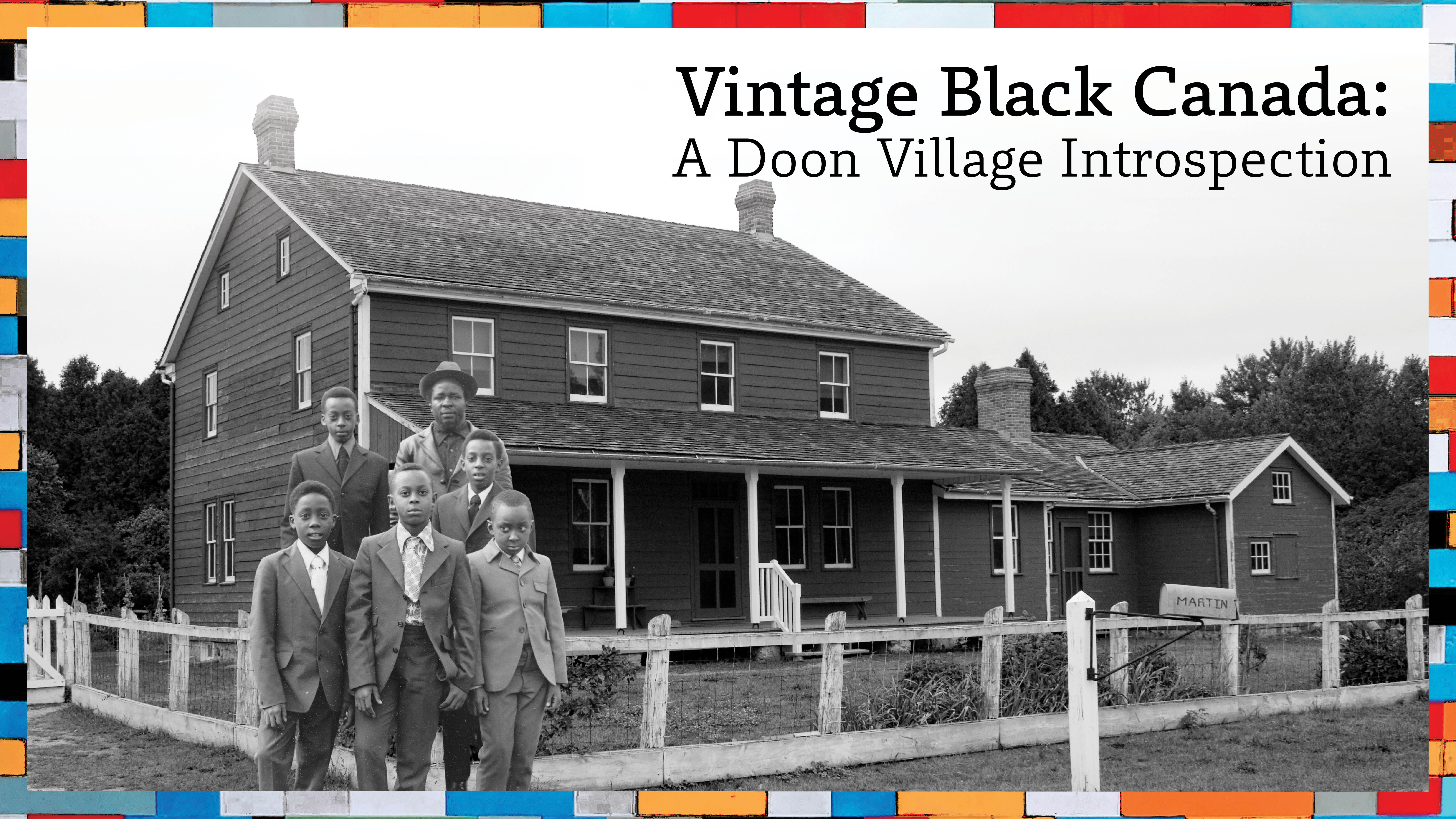 Black and white photo of a group of black kids and one black man in front of the martin house