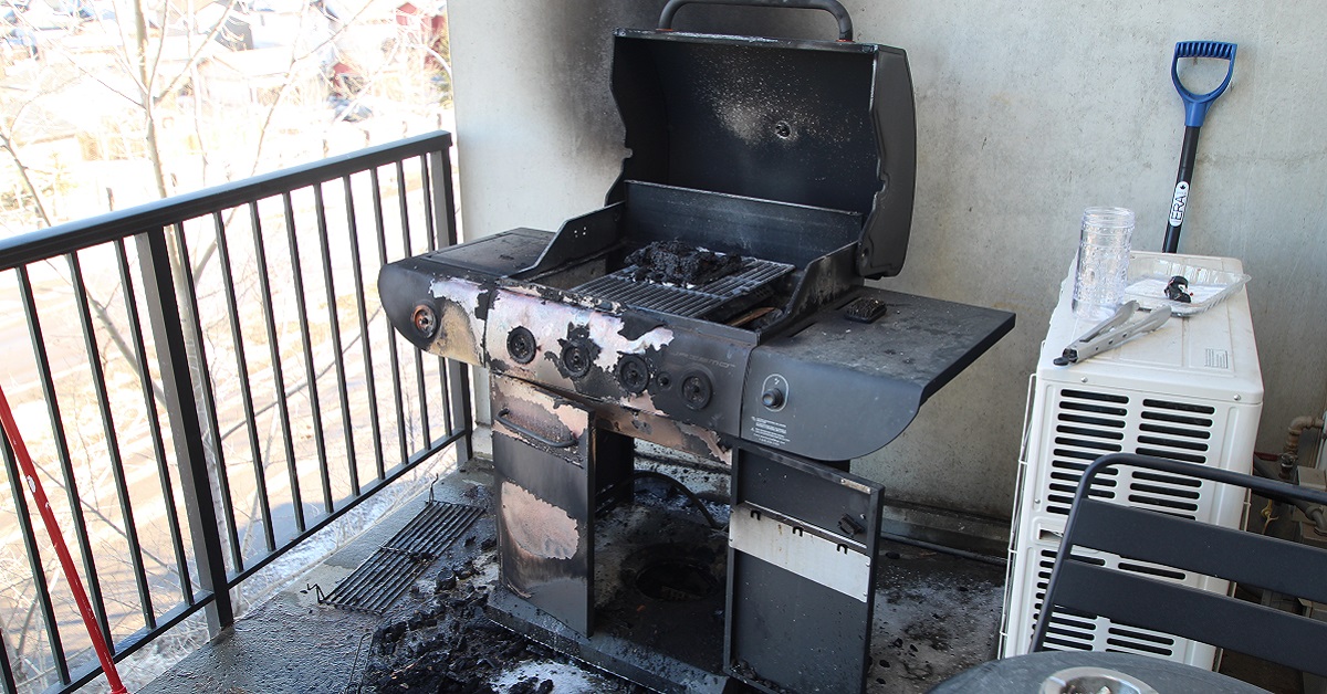 burned barbecue on a deck