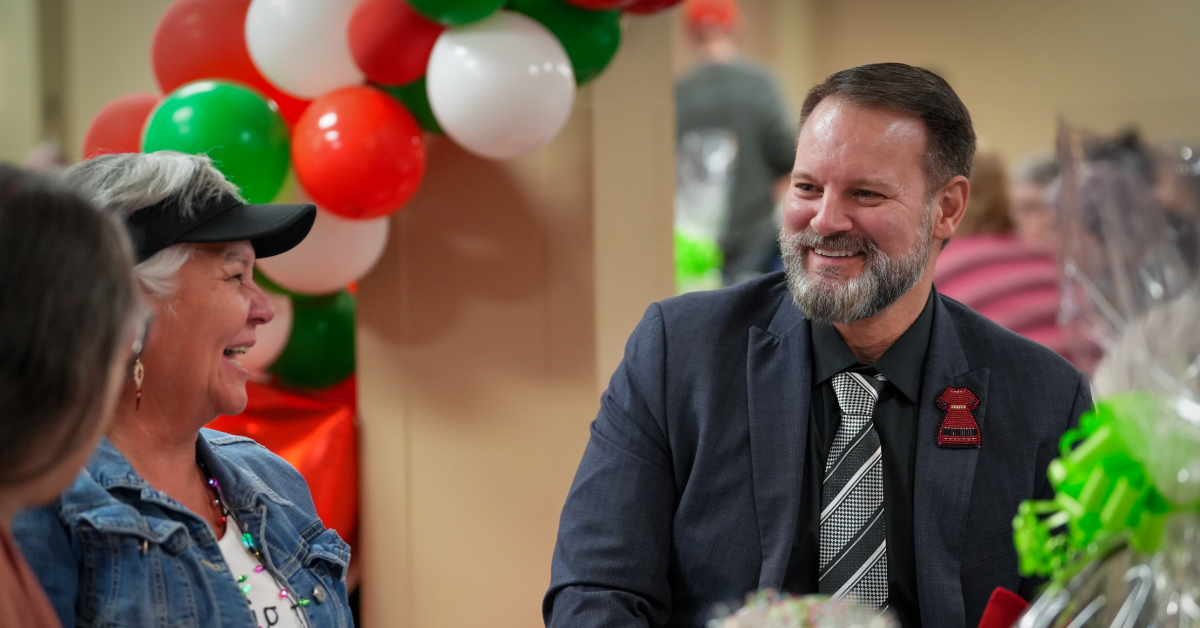 RMWB Mayor Sandy Bowman smiles and chats with attendees at Council's Holiday Luncheon in 2023, at the Quality Hotel in Fort McMurray, Alta.