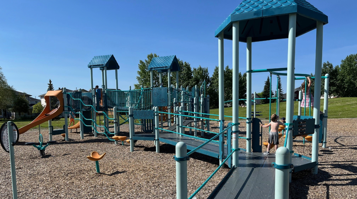 blue and orange park equipment on a sunny day