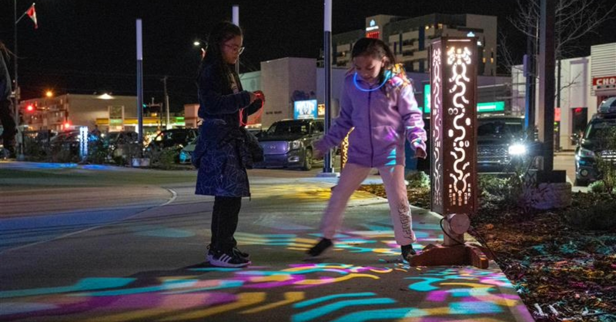Visitors engage with artwork at igNIGHT in 2023.