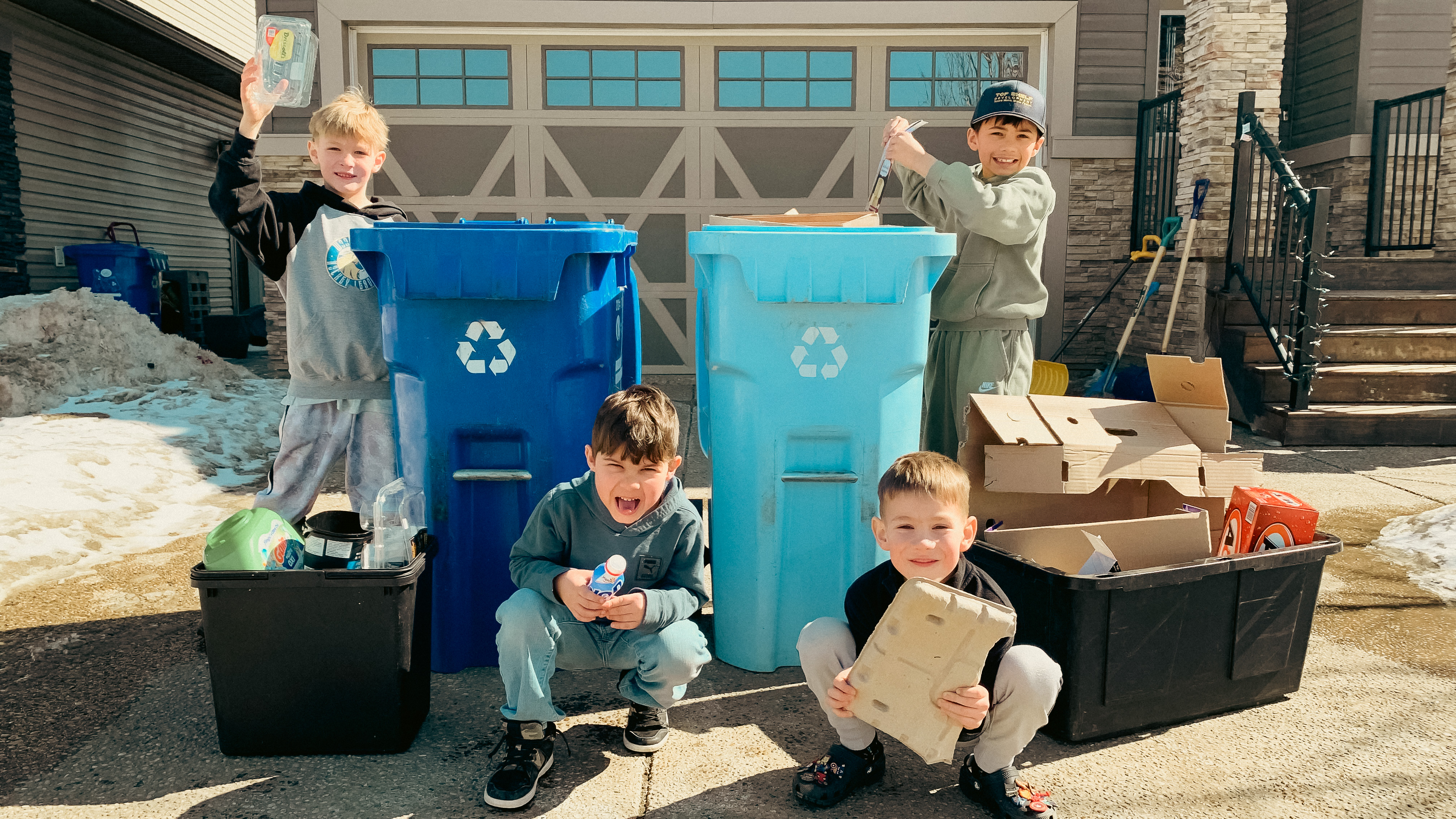 Children recycling in their driveway